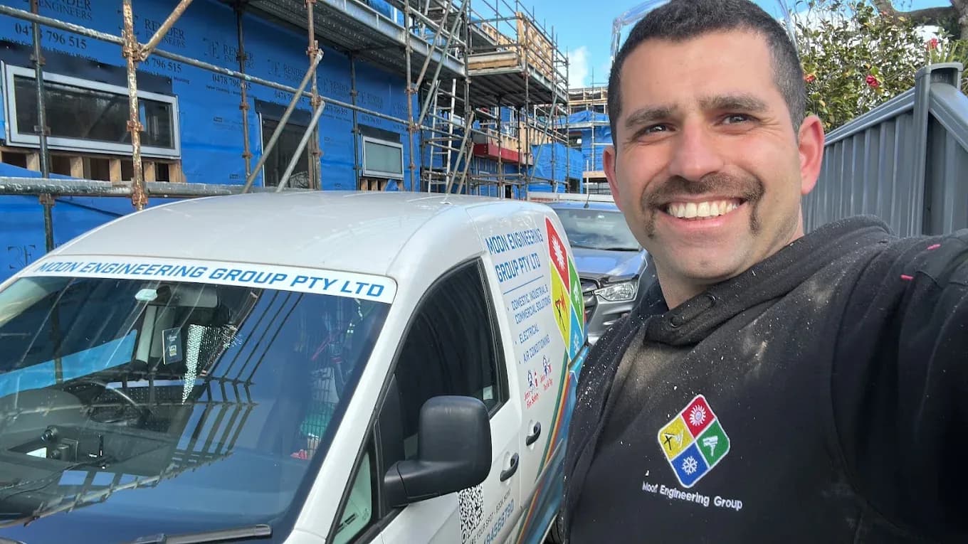 Mark Sharifi standing beside the Moon Engineering Group van on site